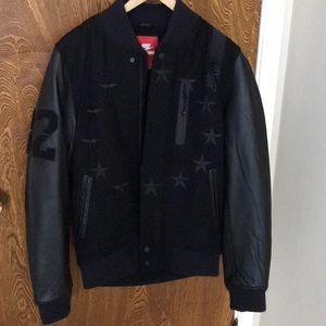 Men Nike Varsity Jacket in black